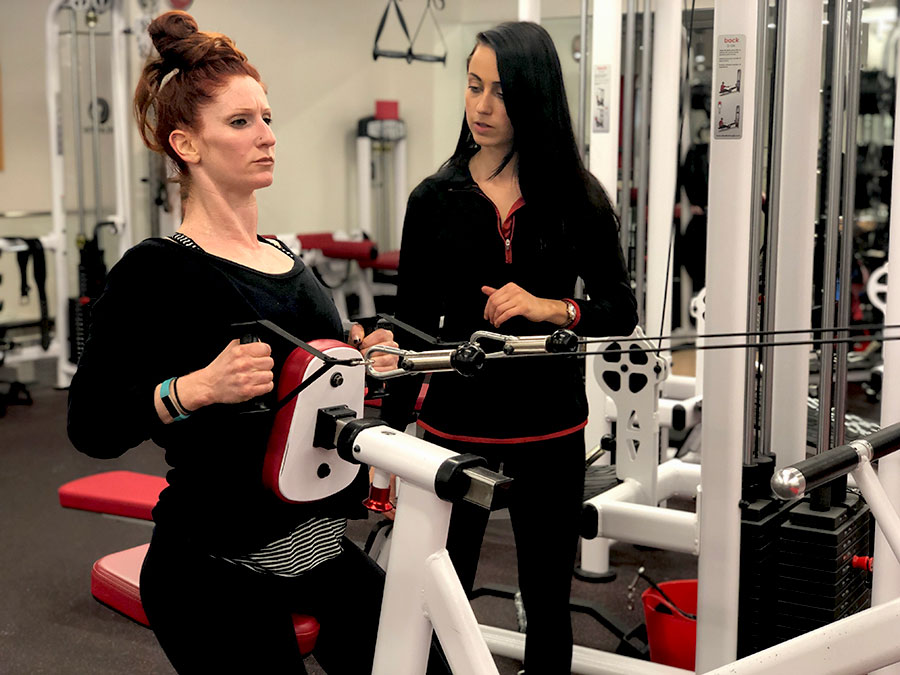 Brooke-in-the-gym-row-with-trainer