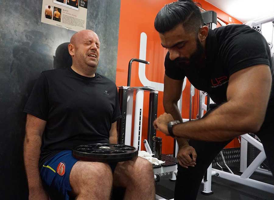 Dan-in-gym-wall-trainer | Ultimate Performance | Ultimate Performance