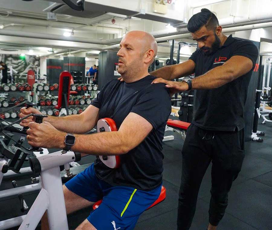 Dan-in-gym-with-trainer | Ultimate Performance | Ultimate Performance