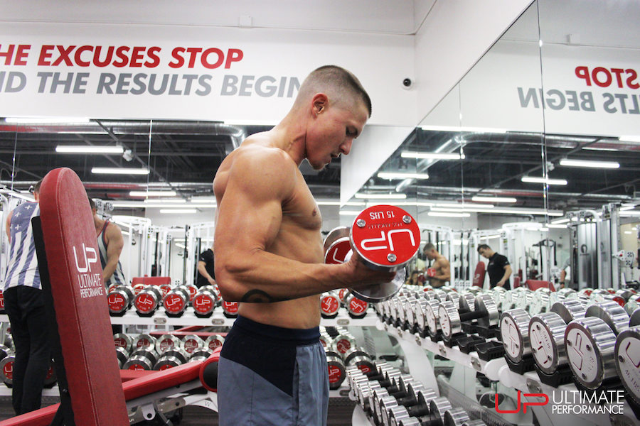 Transgender-parker-performing-bicep-curls-at-up | Ultimate Performance | Ultimate Performance